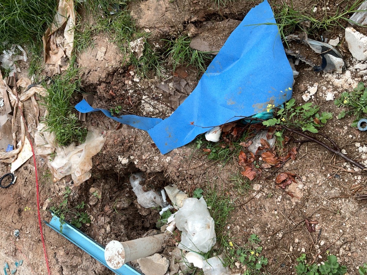 Insufficient cover to stormwater drainage, recorded during a lock-up inspection in Leppington